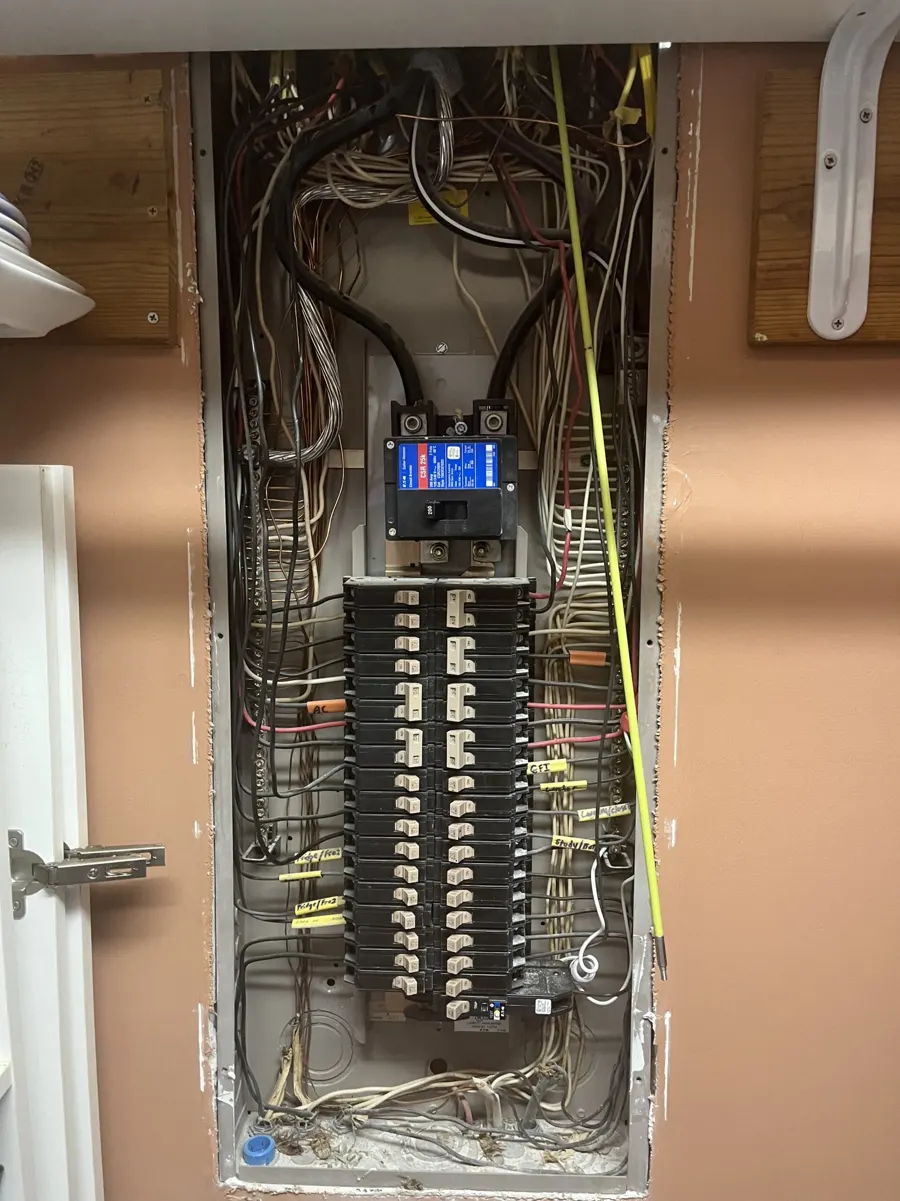 Neatly wired residential electrical panel with new circuits