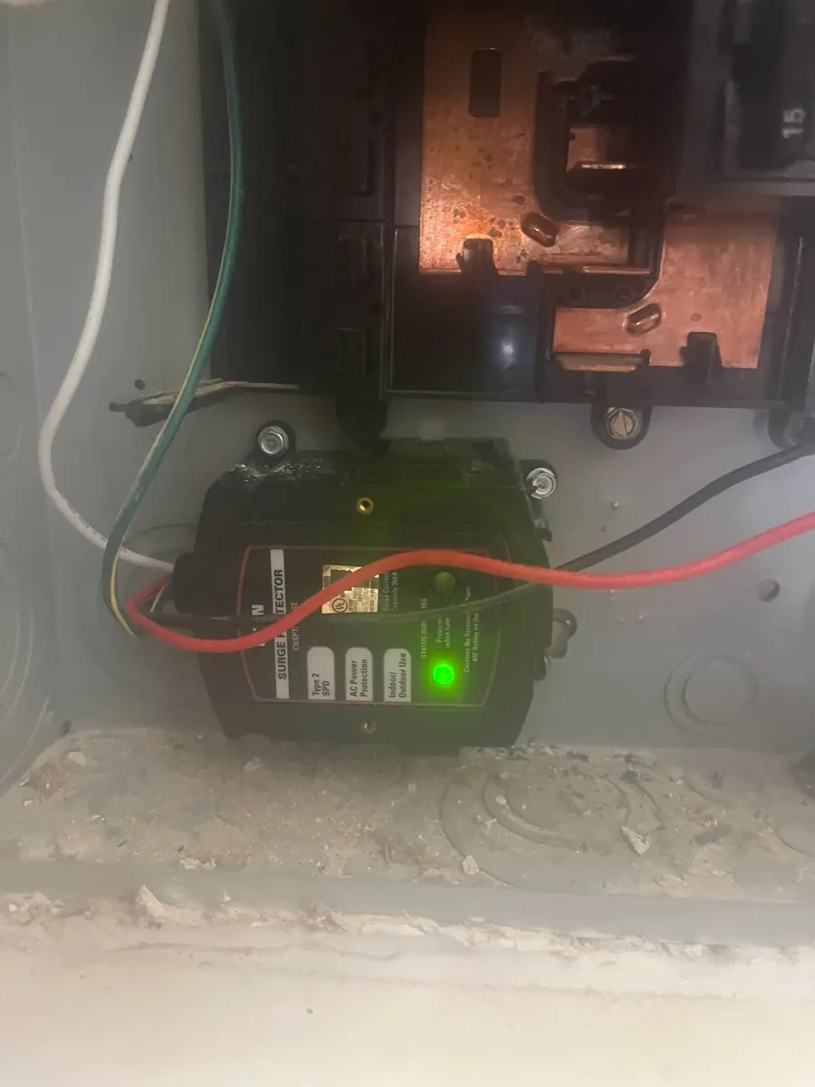 Whole-home surge protector installed inside an electrical panel